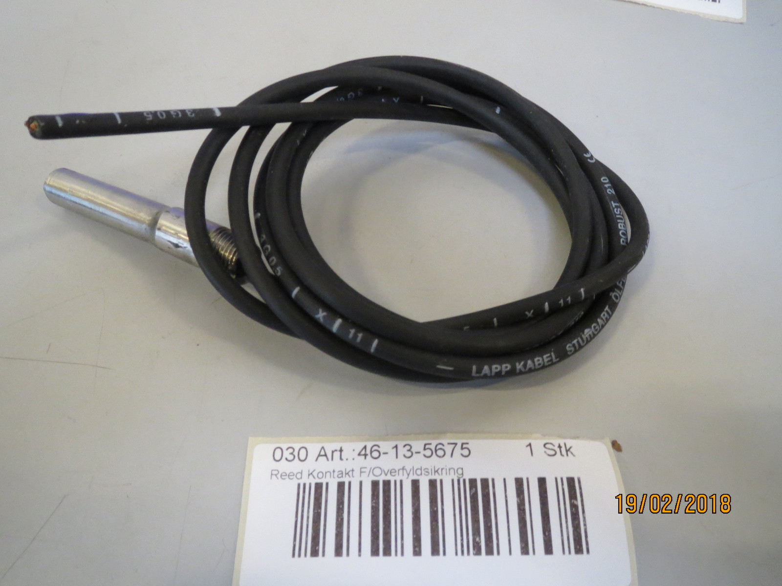 Reed-contact f/overfilling M&M